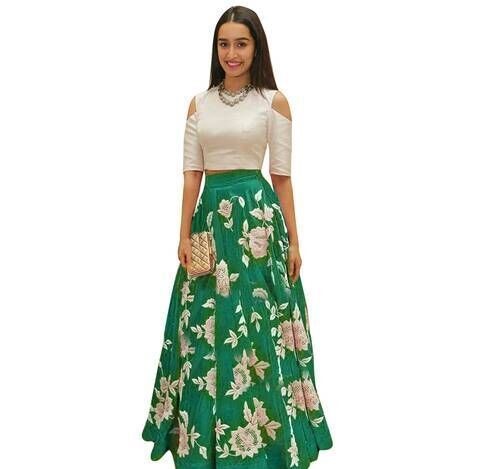 image of sradha Kapoor wearing a white and green party crop top lehenga